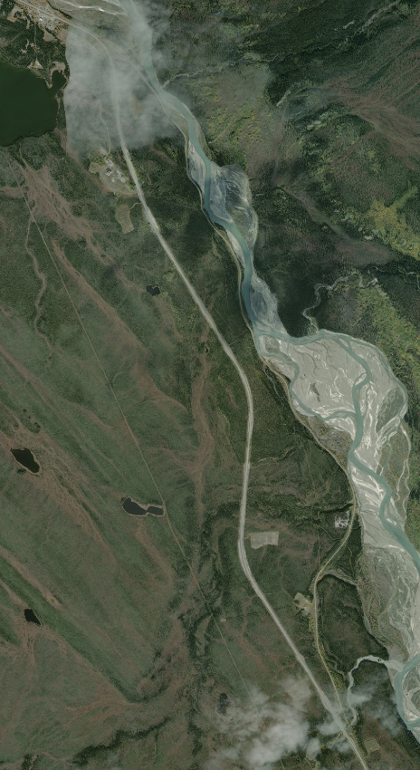 A high-resolution aerial image of the old Alaska Highway along the Kluane River, and the current highway.