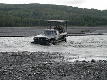 Tour truck crossing the West Fork of the Chulitna River