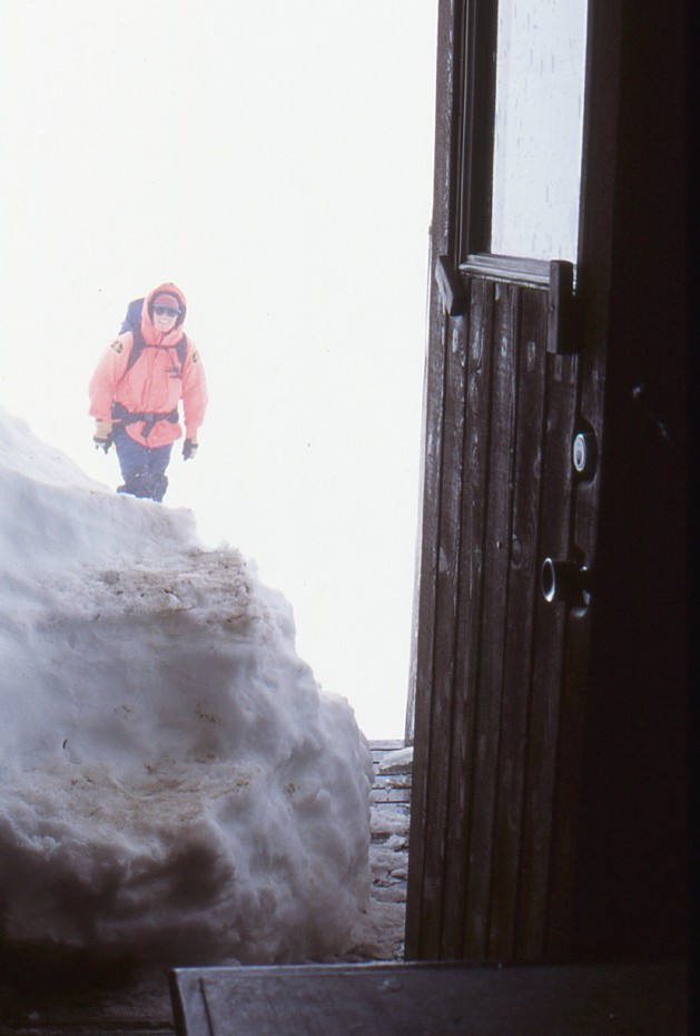Parks Canada rangers in a storm at the Chilkoot Trail summit shelter