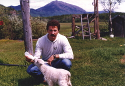 Bottle feeding a baby mountain goat at Telegraph Creek in 1985