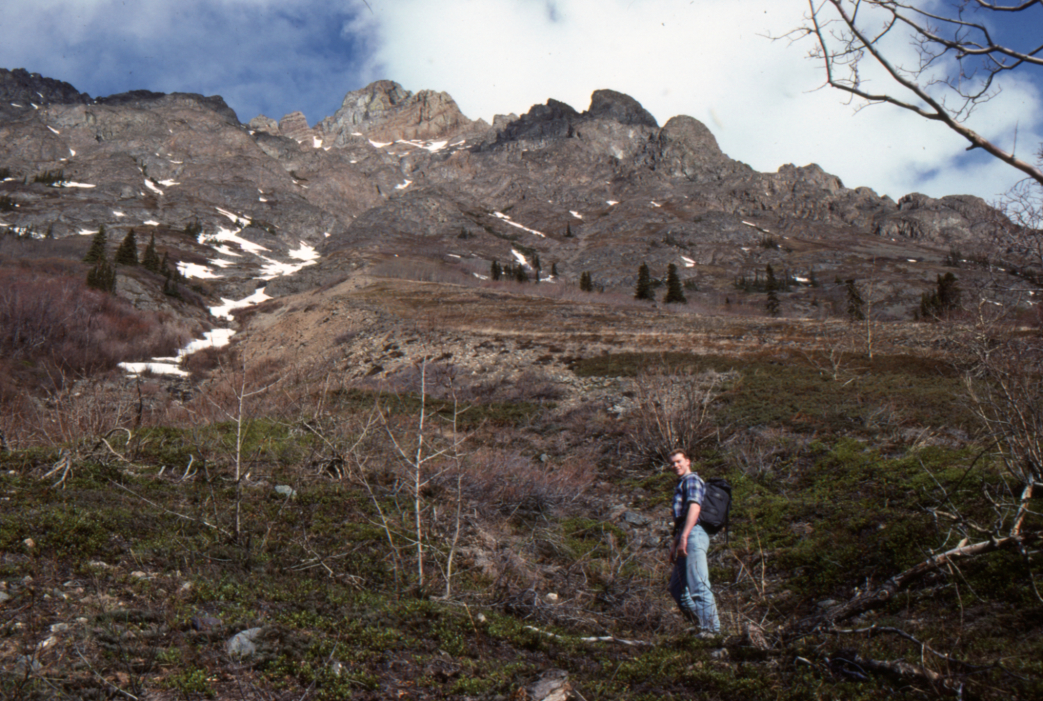 Simon Hutton climbing the slope of Dail Peak looking for old mines.