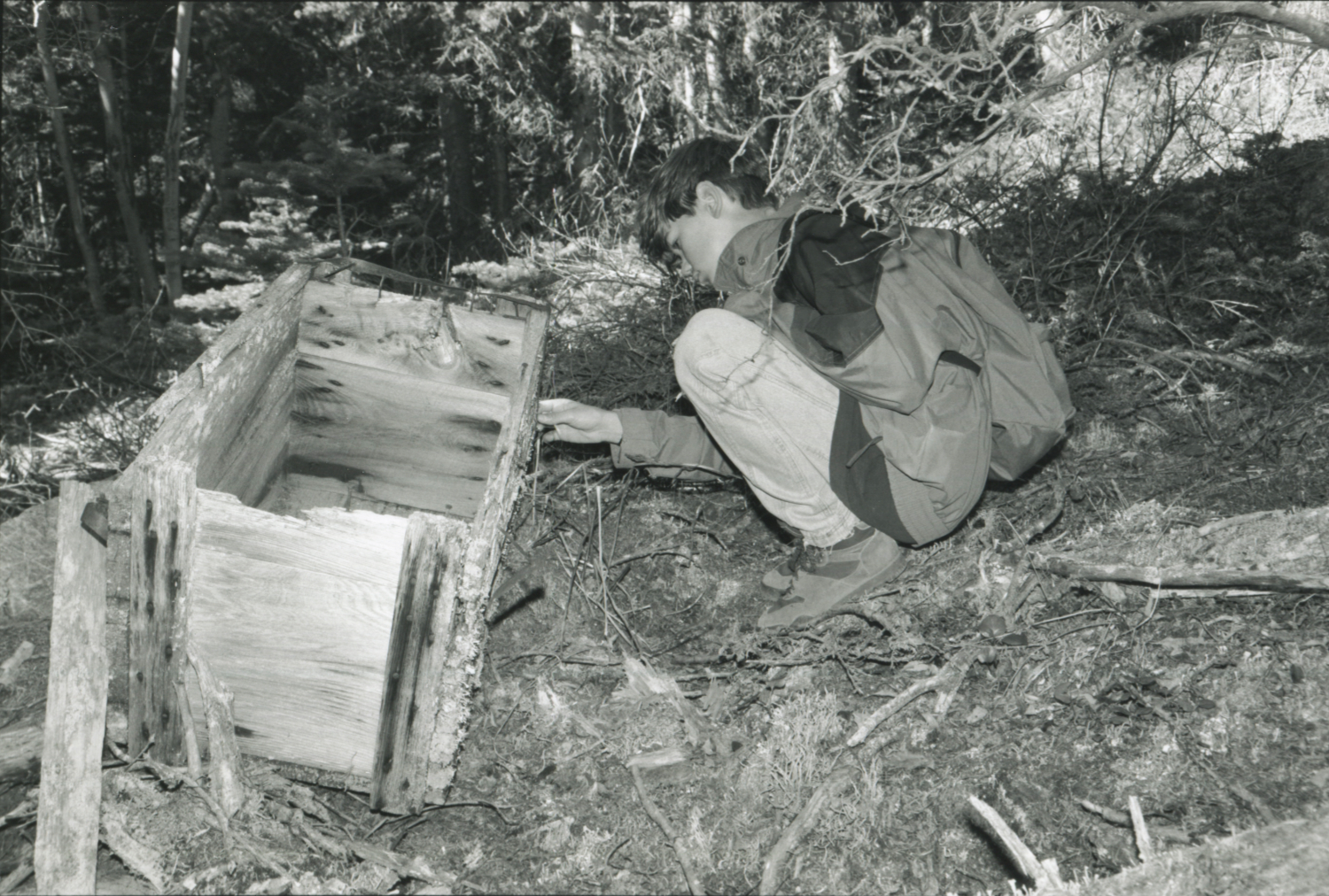 Steve with a pack box along the ca. 1905 pack trail at 920m elevation.