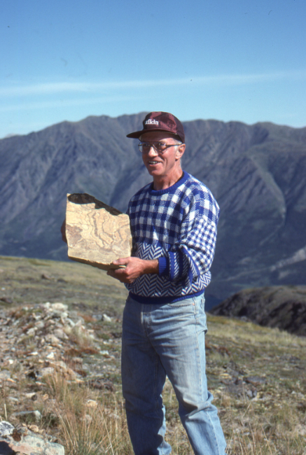 Gord Ryder with what we decided was a dinosaur brain fossil, on Montana Mountain, Yukon.