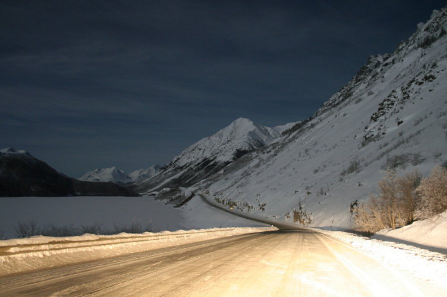 Driving the South KLondike Highway under a winter full moon