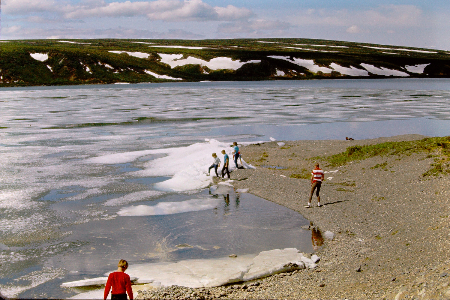 Children plaaying with ice on Summit Lake, Richardson Highway, June 1966