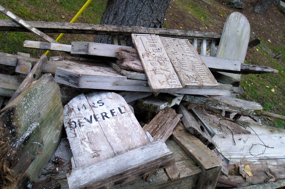 Headboards for Fanny Deverell and Mary F. Murray in the scrap pile during a 2006 cleanup at the Pioneer Cemetery at Skagway, Alaska