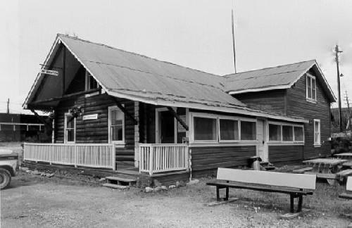 View of the General Manager's House, showing the overhanging gable roof supported on wood brackets, 1988. Photo by Parks Canada.