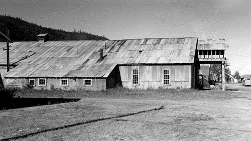 Side view of the Machine Shop, showing its impressive scale and massing, 1988. Photo by Parks Canada.