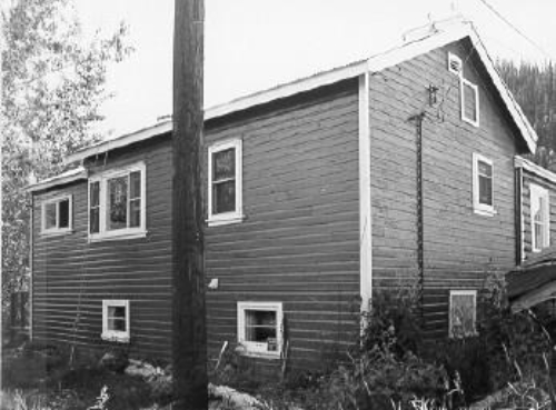 View of the Staff House, showing its two-storey wood-frame addition, 1988. Photo by Parks Canada.