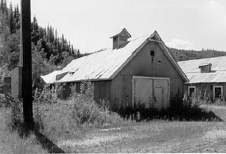 View of the Carpentry Shop at Bear CReek, showing the simple and functional nature of its design, 1988. Photo by Parks Canada.