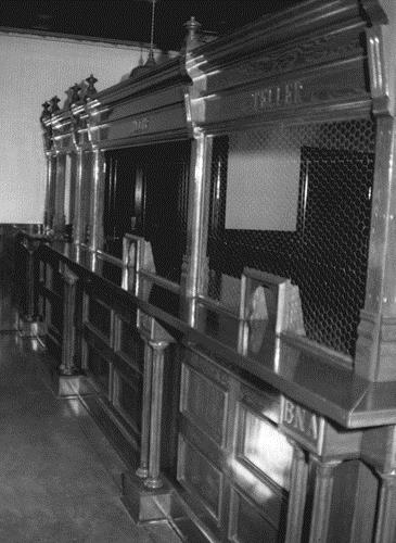Detail view of the Bank of British North America, showing the interior partitioning and finishes, 1988. Photo by J. Mattie, via Parks Canada.