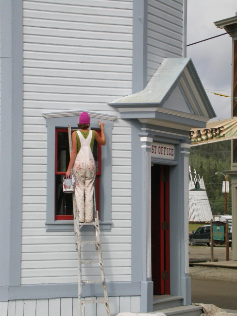 Touching up the paint on the old post office in Dawson City on August 4, 2007. Photo by Murray Lundberg.
