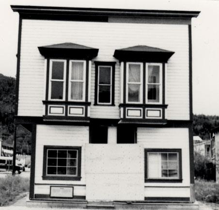 General view of Ruby's Place, showing the two-storey form and massing of the gable-roofed, symmetrical, false-fronted structure, 1987. Photo by Parks Canada.