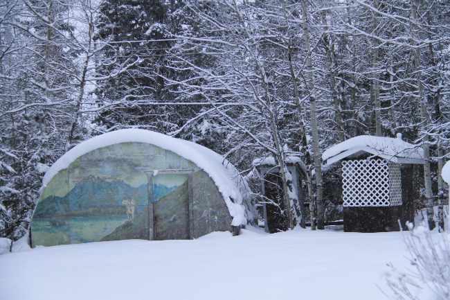 An outbuilding and outhouse behind Our Lady of the Way Catholic Church on December 14, 2012. Photo by Murray Lundberg.