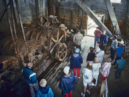 Interior view of Dredge No. 4 showing its materials such as the wooden hull and metal equipment, 1995. Photo by Wayne Lynch, via Parks Canada.