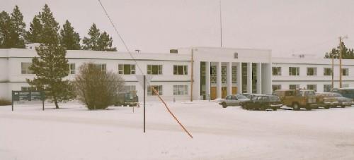 Side elevation of Building 200, showing the large, two-storey massing of the flat roofed structure, 1991. Photo by Public Works Canada.