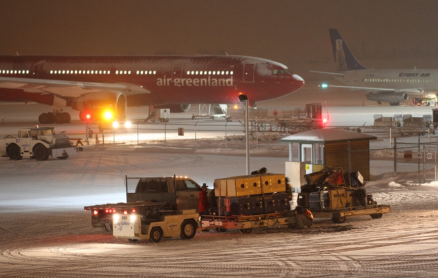 Mushers loading their huskies into jets at Whitehorse, Yukon