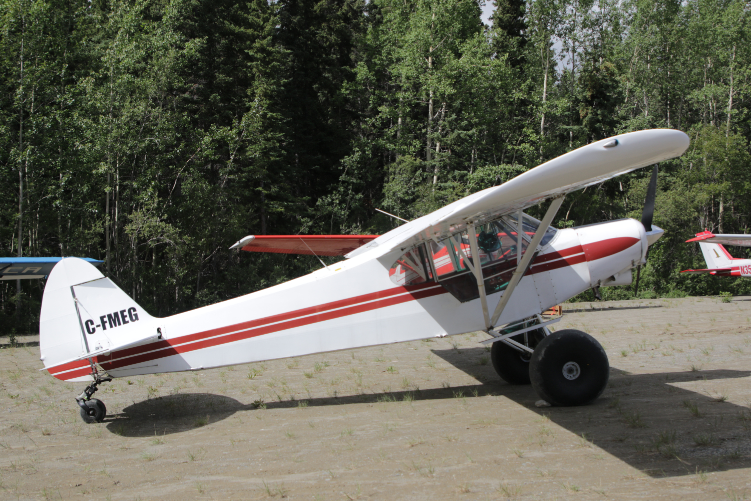 C-FMEG, a 1962 Piper PA-18-150 Super Cub, at Cousins Airport, Yukon (CFP8), on July 25, 2026.
