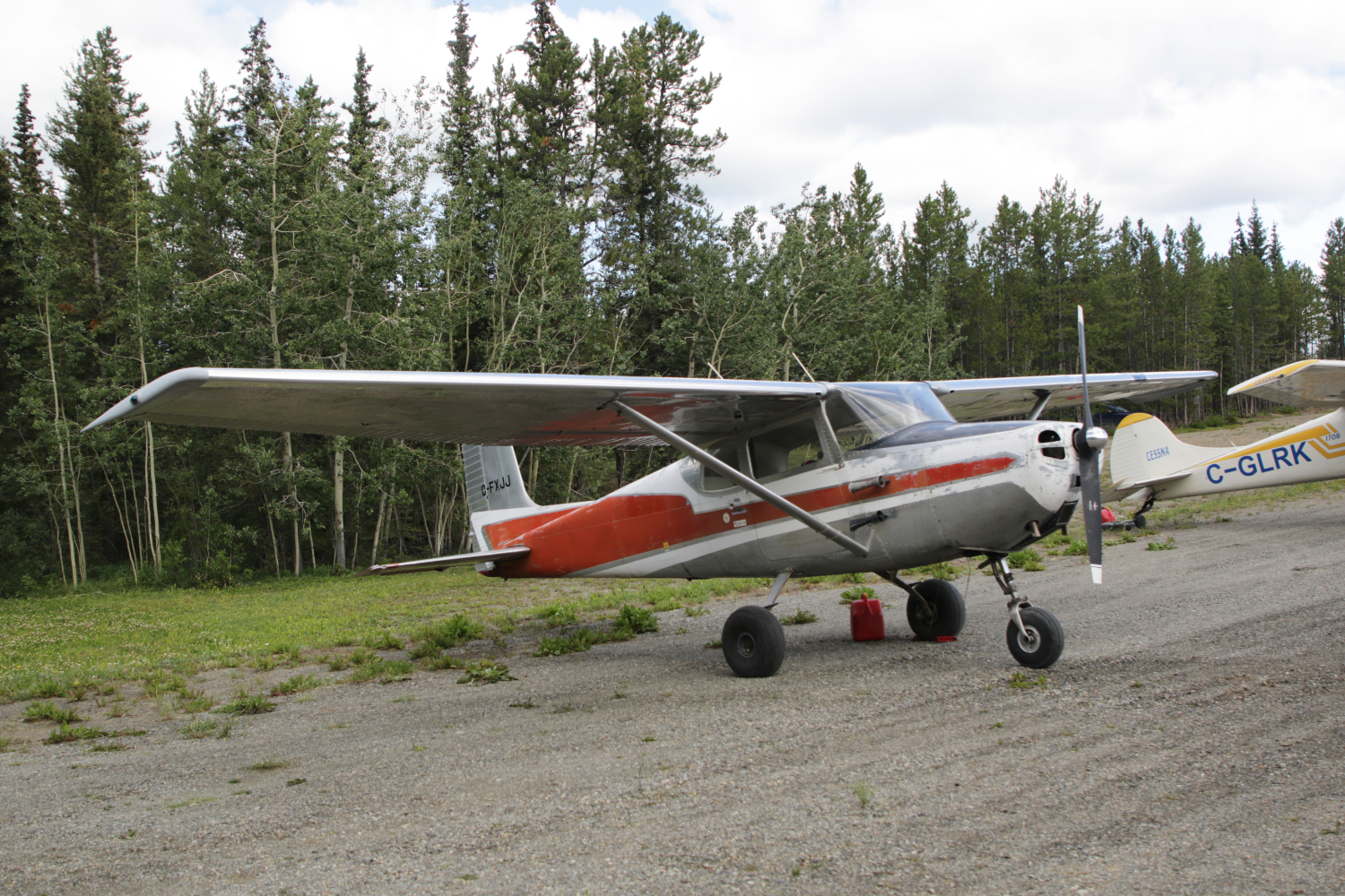 A photo of C-FXJJ, a 1957 Cessna 172, at Cousins Airport, Yukon (CFP8), on July 25, 2026.