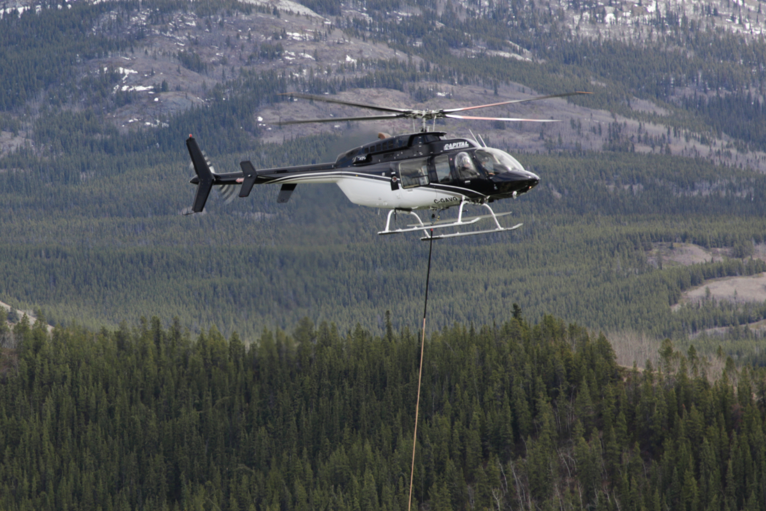 C-GAVQ, Capital Helicopters' Bell 407, doing fire bucket practice at Schwatka Lake, Whitehorse, Yukon, on May 6, 2026.