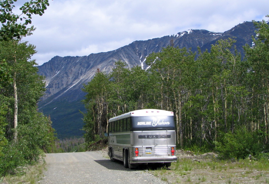 Norline Coaches MCI motorcoach on the Dalton Post road, Yukon