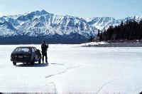 Driving on the ice of Kluane Lake, 6 miles from the nearest road, the Alaska Highway