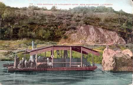 Postcard of a gold dredge working on the Sacramento River in California, 1908.