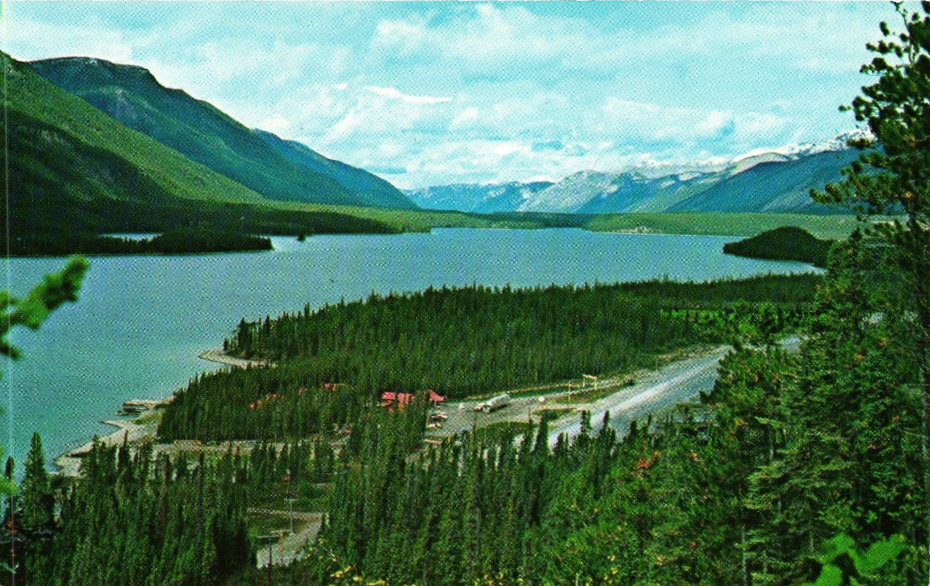 Postcard showing Highland Glen Lodge and Muncho Lake from a high hiking trail, ca. 1985.