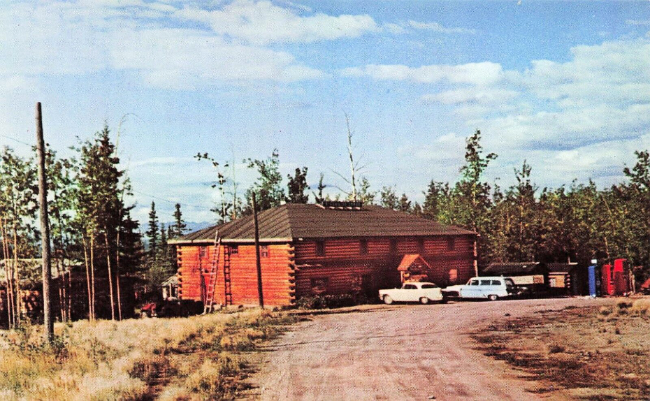 Postcard showing the large log lodge on the Alaska Highway ca. 1958.