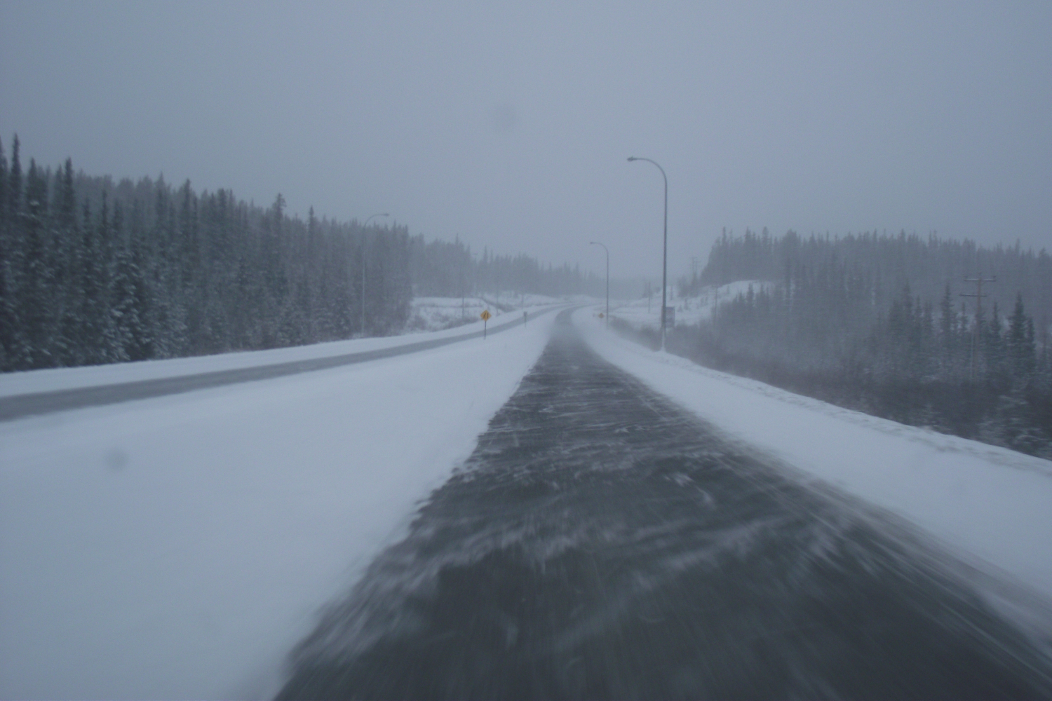 Flat winter light on the Alaska Highway.