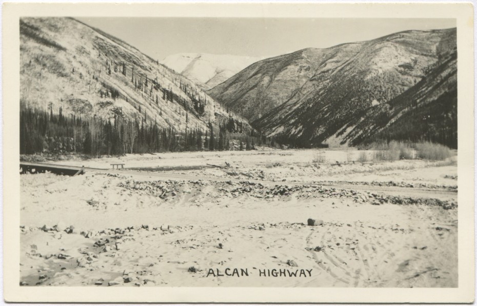 Alaska Highway postcard showing the new road crossing a small bridge on an outwash plain near Muncho Lake in the 1940s