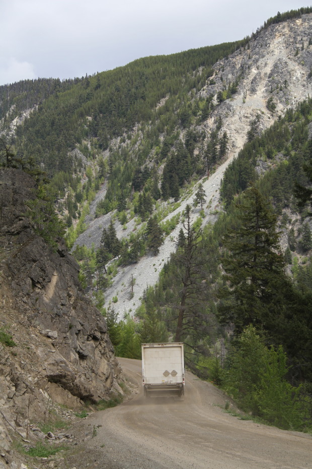 A truck climbs through a single-lane section at Km 3.0 of the Bella Coola hill.