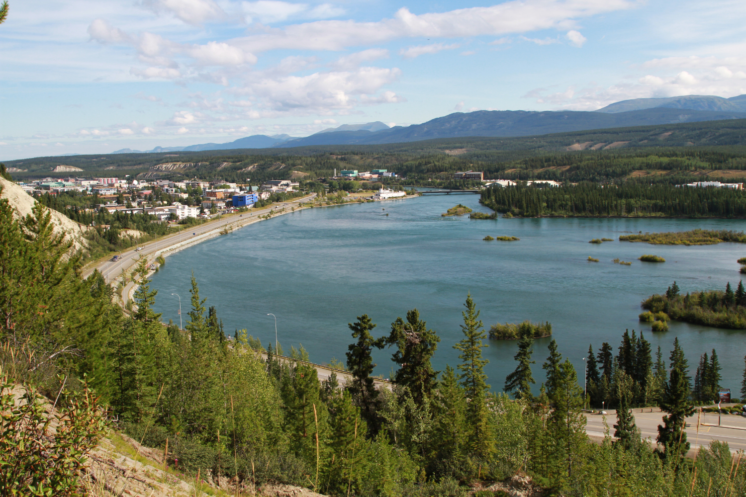 The southern entrance to Whitehorse, with the sternwheeler Klondike sitting on the bank of the Yukon River in early August.