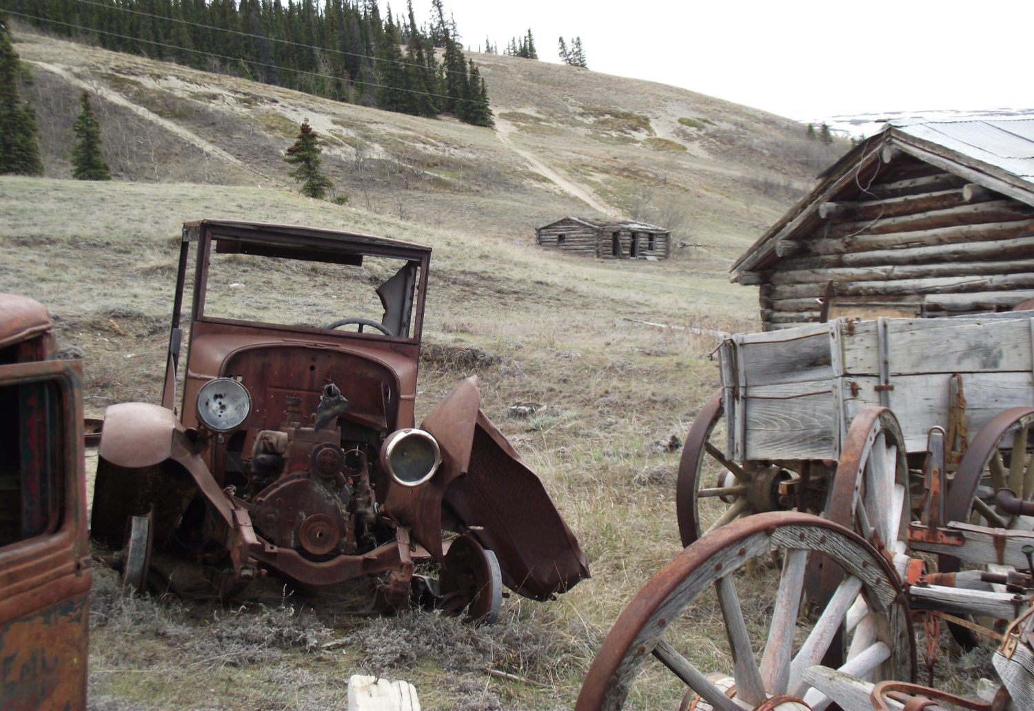 Old trucks and wagons at Champagne, Yukon