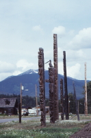 A photo of a line of totem poles in Kitwanaga, BC