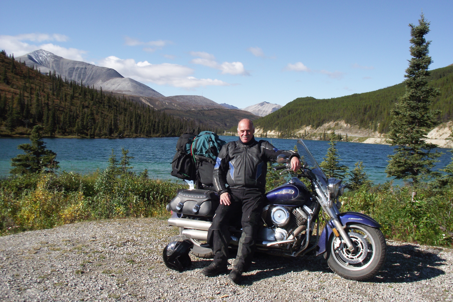 ExploreNorth editor Murray Lundberg on his motorcycle at Summit Lake, Alaska Highway.