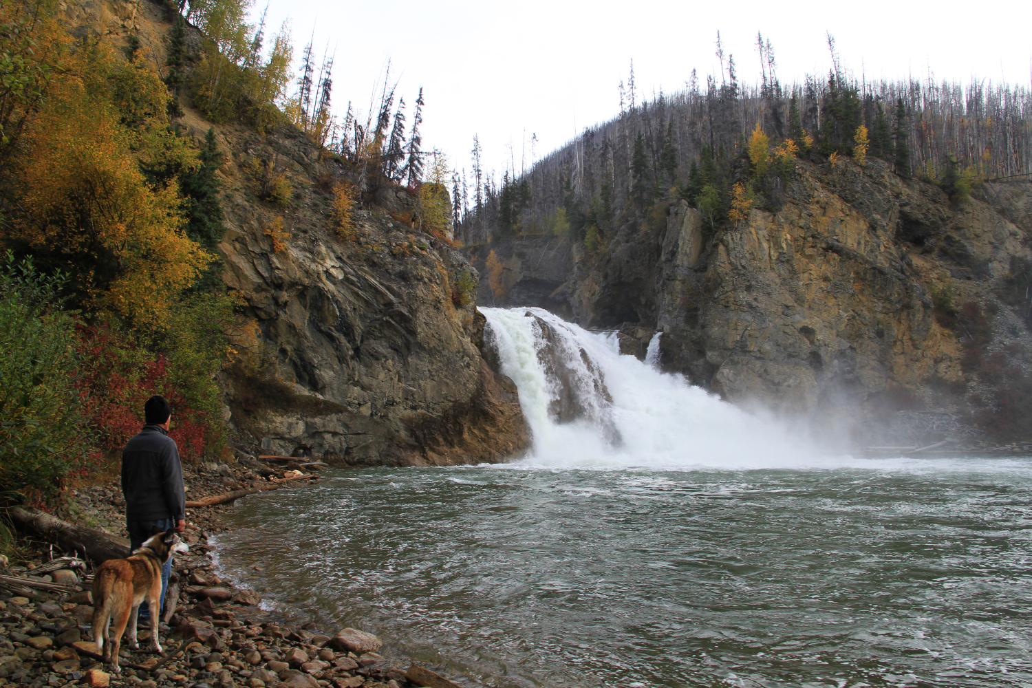 ExploreNorth editor Murray Lundberg with his dog Monty at the base of Smith River Falls in mid September. 
