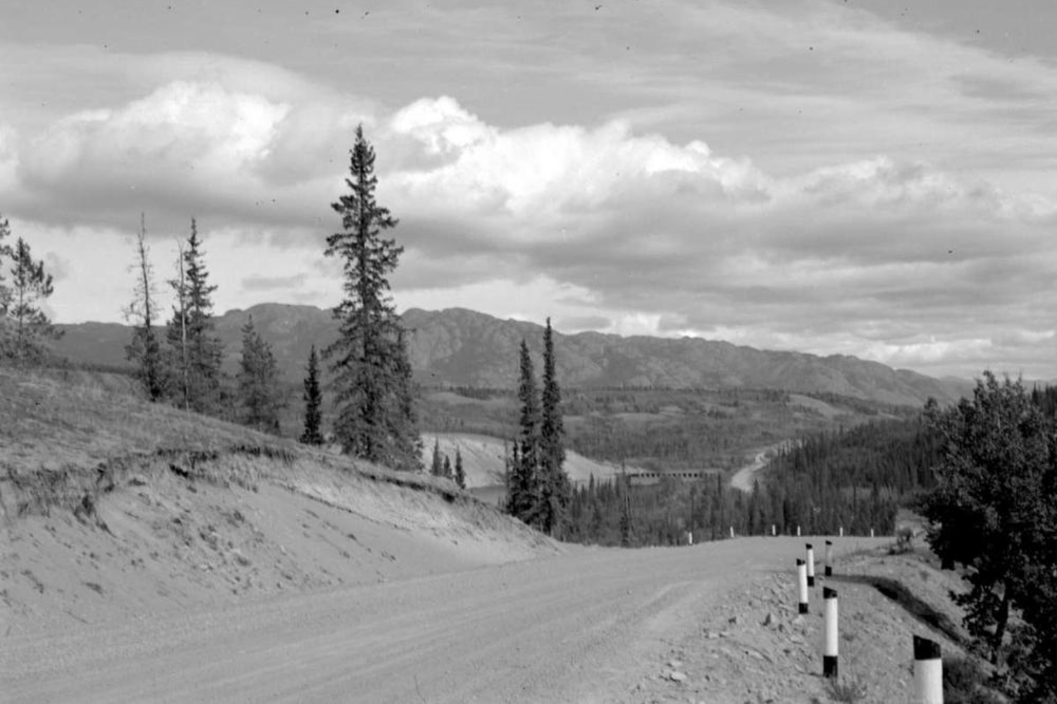 The Alaska Highway just west of the Yukon River bridge in 1951