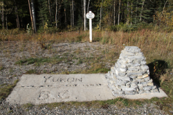 Unofficial Yukon/BC border monument at Historic Km 905 / Mile 585 on the Alaska Highway