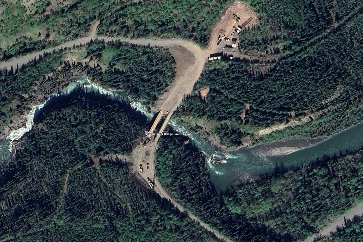 An aerial view of the  the Lapie River Bailey bridge over the canyon at Km 212.9 of the South Canol Road, 2023