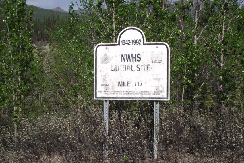 A North West Highway System (NWHS) Burial Site - the Lt. Roland Small cenotaph along the old Alaska Highway along the Kluane River, Yukon.