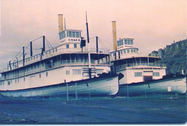 The sternwheelers 'Casca' and 'Whitehorse' sitting alongside the Yukon River