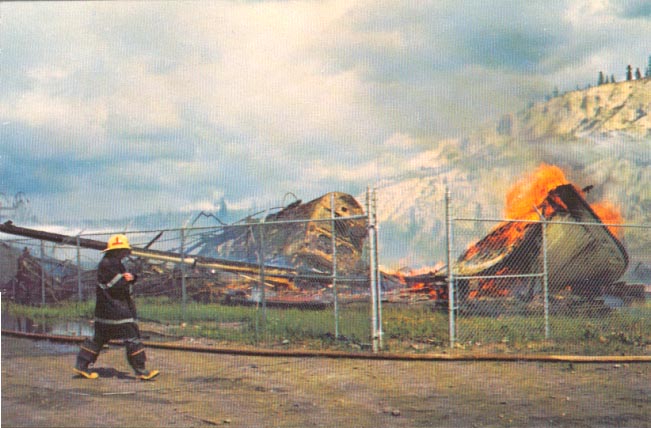 The sternwheelers 'Casca' and 'Whitehorse' burning alongside the Yukon River