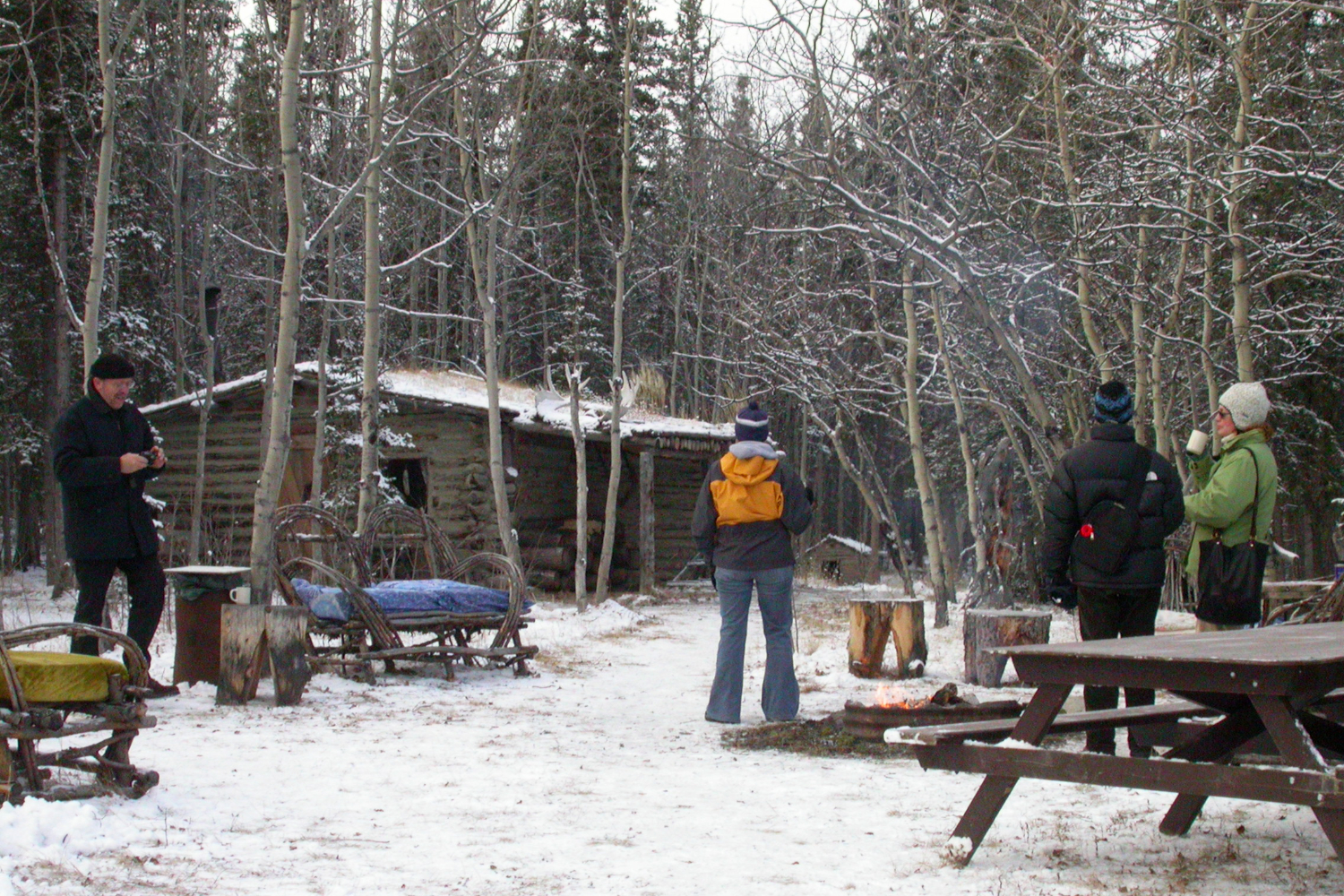 Enjoying tea and bannock around the campfire at Kwaday Dan Kenji - Champagne, Yukon.