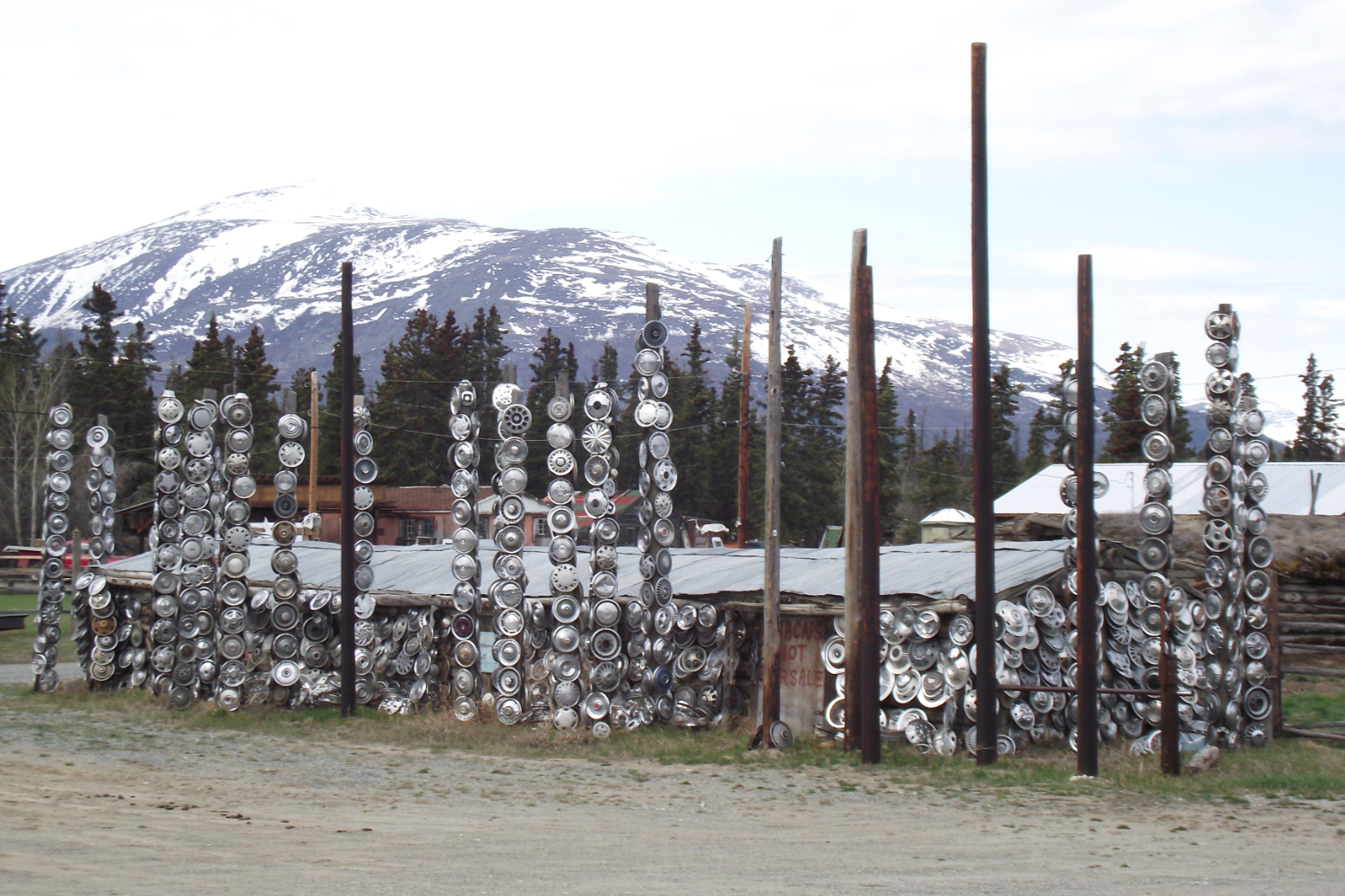 Hubcap totem poles at Champagne, Yukon.
