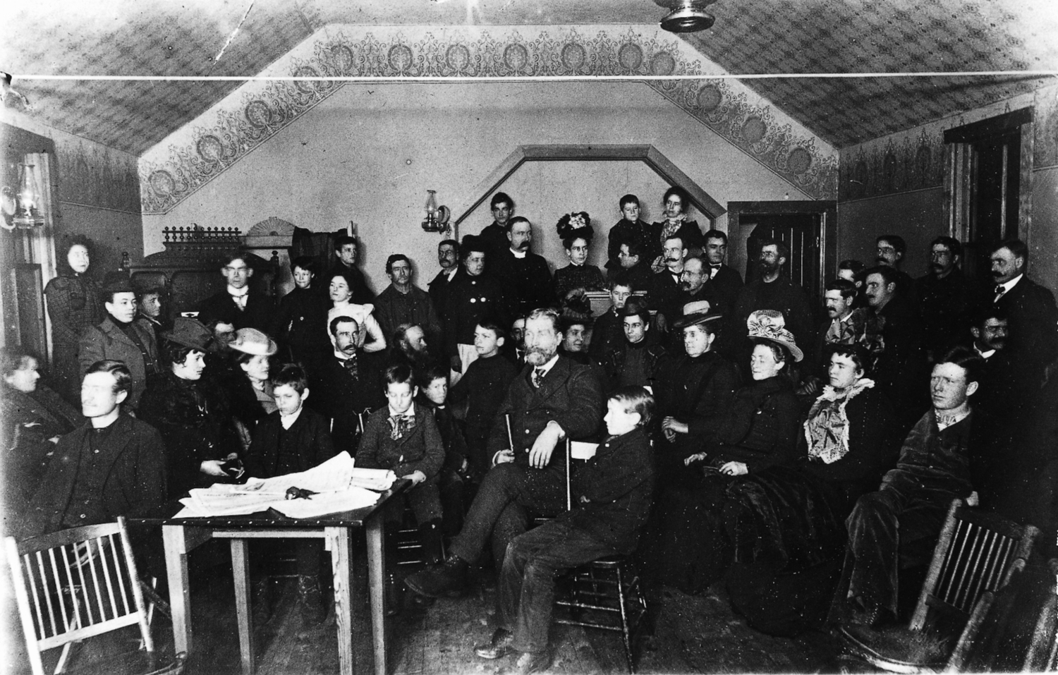 The Rev. Wright and his congregation in the Presbyterian Church, Whitehorse, Yukon Territory, 1900