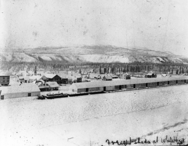 Freight sheds along the Yukon River at Whitehorse, Yukon Territory, 1900
