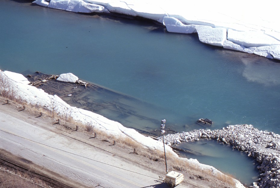 The sternwheeler Canadian being buried by a new road construction project at Whitehorse, Yukon