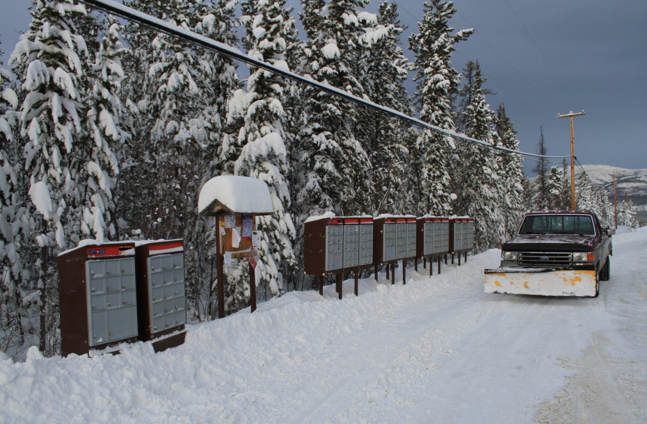 Picking up the mail in a rural subdivision in Whitehorse, Yukon